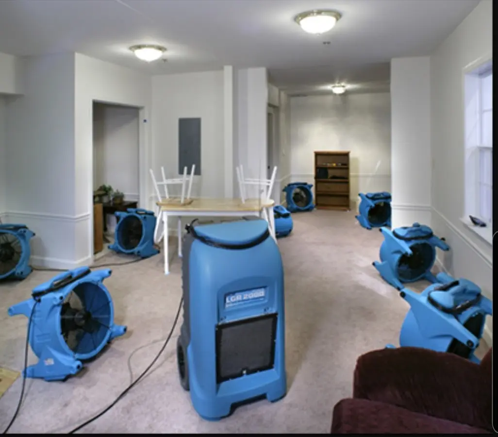 Air movers and dehumidifier setup for Water Extraction & Removal in Ira